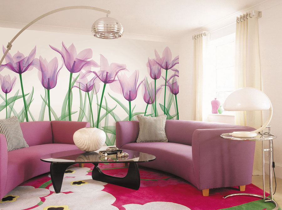Bright sitting room with pink and purple curved sofas, arching floor lamp, and graphic floral rug. ?nterior design, styled interior, interior, photography, colour image, horizontal image, indoors, day, nobody, sitting room, living room, pink, purple, hot colour, sofa, couch, curving, upholstered, matching, modern, contemporary, floor lamp, table lamp, lamp, floral, rug, glass top, coffee table, cushion, window, curtain, drape, bold, artwork, disco, Seventies, vibrant, vivid, colourful, eclectic, eccentric, lavender, purple, window, curtains, ðððððð